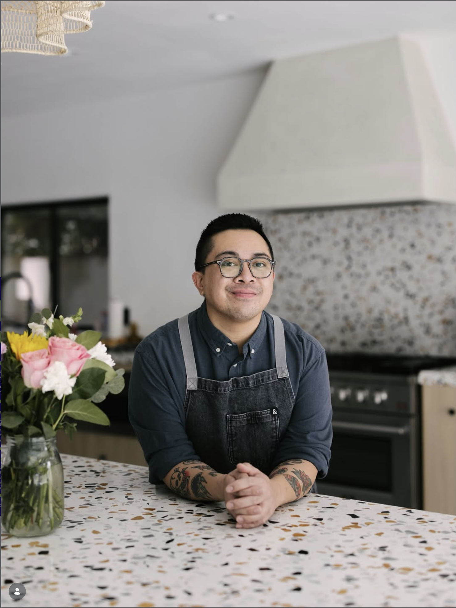 Gen, the chef of Gen's Luncheonette, smiling in his kitchen in Cathedral City Cove.